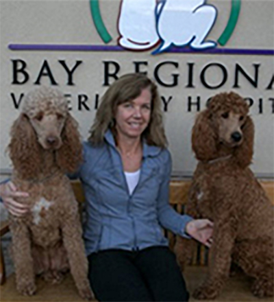 Dr Linda Hack with two dogs